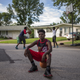 Randy Johnson, 17, a high school student, poses for a portrait between games of basketball outside a friend’s residence.